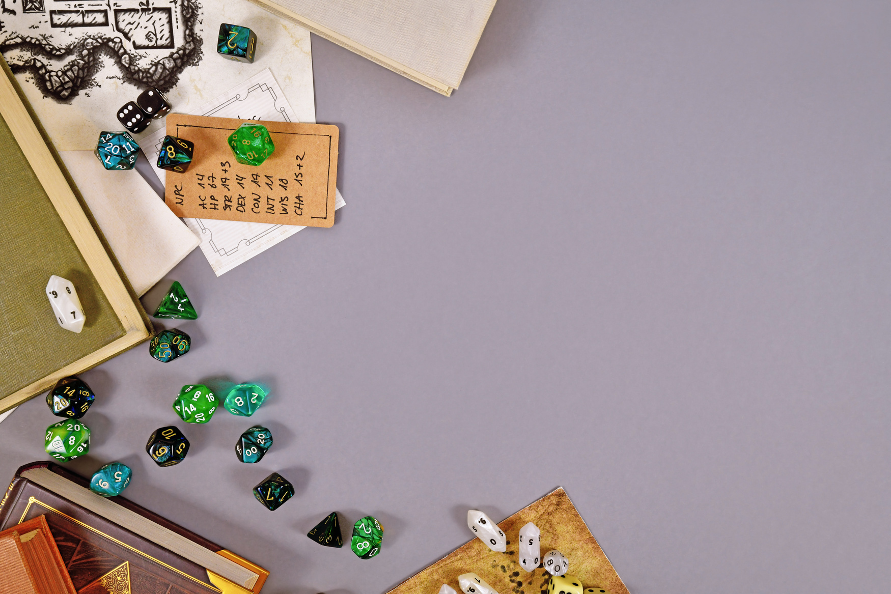 Tabletop roleplaying flat lay with RPG and game dices, rule book